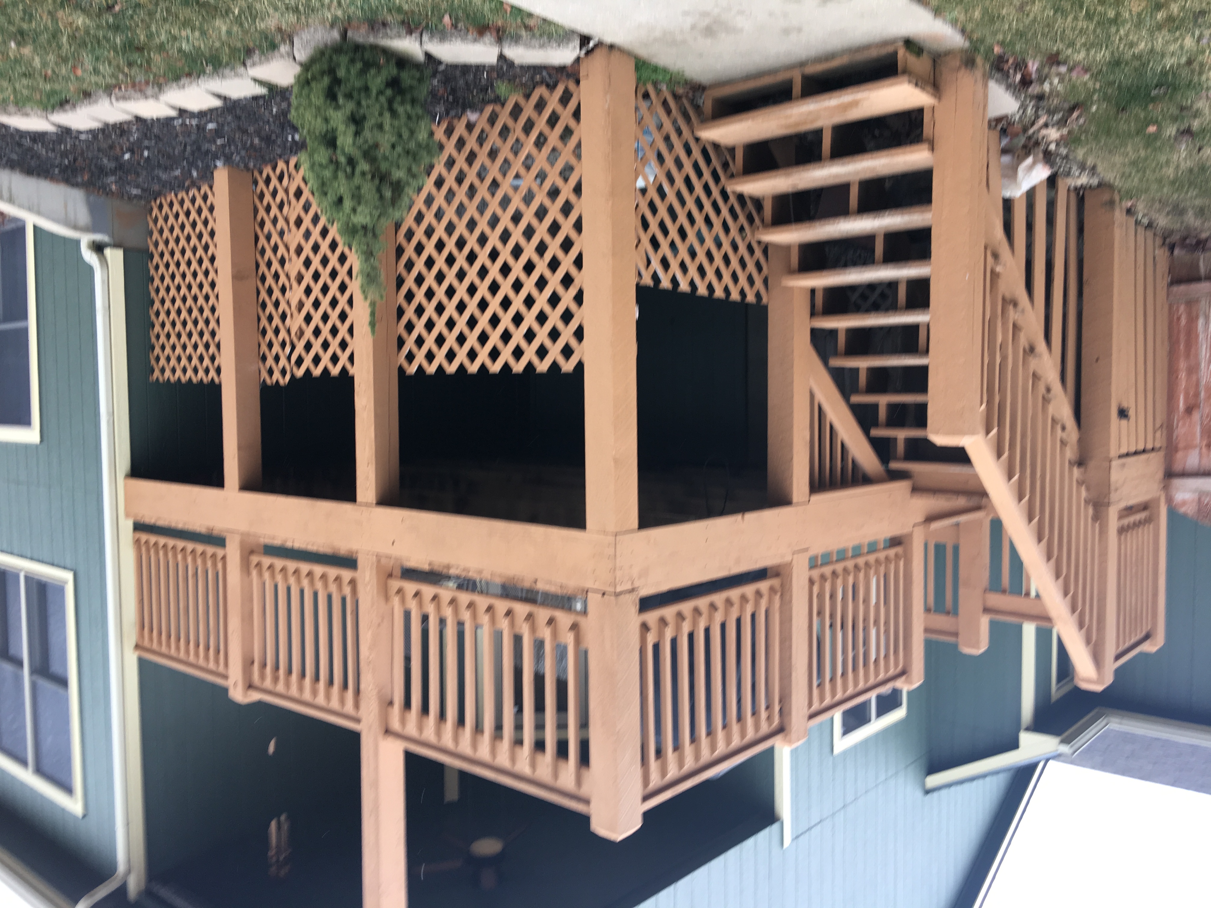 brown deck with no screen and missing trellis