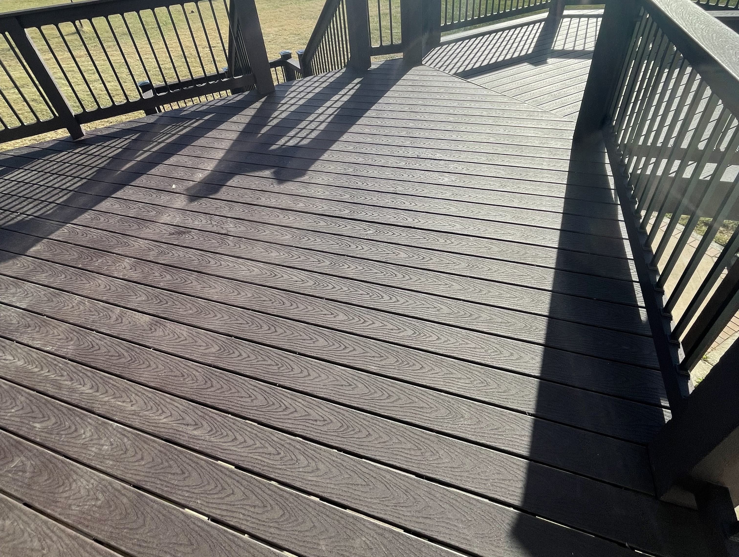 dark brown deck floor with black railing