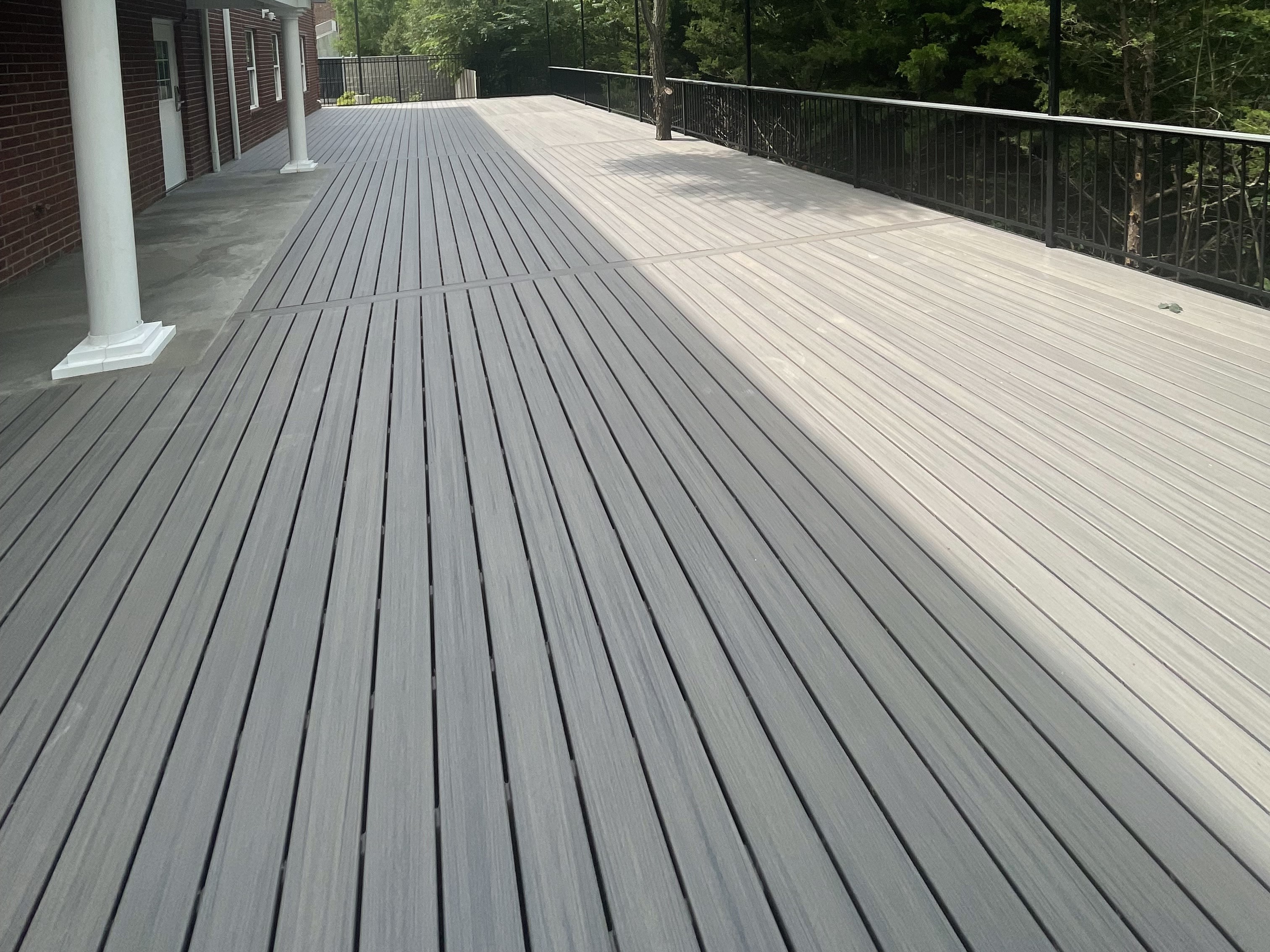 light gray deck floor with black steel railing around it